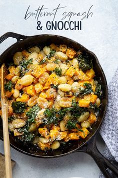 a skillet filled with potatoes and spinach