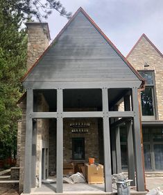 the front of a house is being built and ready to be remodeled with new windows