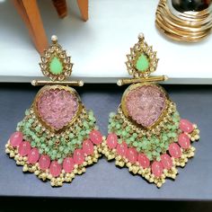 Variants Ruby Green Blue Pink Indulge in the opulence of Indian bridal jewelry with our Mint Pink Dyra Gold Plated Kundan Earrings. Exuding timeless elegance, these exquisite earrings are a masterpiece of craftsmanship, blending traditional allure with contemporary flair. Adorned with delicate pink and mint beads, luminous kundan, and lustrous pearls, each piece is meticulously handcrafted to perfection. Crafted to evoke the grandeur of desi jewelry, these earrings are a celebration of femininit Desi Jewelry, Indian Bridal Jewelry, Pink And Mint, Modern Womens Fashion, Kundan Earrings, Bridal Jewellery Indian, Kundan Jewellery, Pink Beads, Stunning Earrings