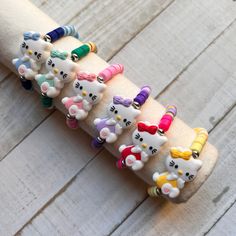 This cute, fun-loving colorful inspired KITTY silicone BPA-FREE charm is the star of the Inspired KITTY Stretch Bracelet made with colorful heishi beads. This cute Inspired  KITTY Summer Stretch Bracelet is perfect gift for any occasions.  The silicone kitty charm is double sided, so never have to worry that the charm is flipped backward. Details: *1.18 in/30 mm BPA free silicone bead Inspired Kitty charm.    *6mm color polymer clay heishi beads *5mm silver plated hematite beads Please note: Due Colorful Adjustable Playful Friendship Bracelets, Cute Colorful Adjustable Stretch Bracelet, Cute Multicolor Stretch Bracelet, Multicolor Hypoallergenic Fun Friendship Bracelets, Playful Adjustable Stretch Bracelet, Fun Multicolor Hypoallergenic Friendship Bracelets, Colorful Adjustable Cute Friendship Bracelets, Adjustable Novelty Bracelet In Colorful Designs, Adjustable Playful Friendship Bracelets