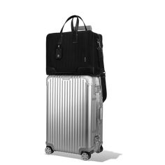 Made in Italy, the RIMOWA Never Still collection is designed with flexibility in mind. Crafted out of premium materials like durable canvas and full-grain leather, the RIMOWA Never Still Weekender in Black is designed to carry travellers through the weekend, no matter the destination. It includes a spacious interior with two zipped compartments that easily fit everything needed for a city break or business trip—featuring a series of interior pockets that hold a 13-inch laptop, mobile phone, and Canvas Weekender Bag, Flat Pouch, Business Trip, Iphone Accessories, City Break, Large Backpack, Gift Store, Cool Suits, Bag Women