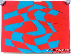 a red and blue piece of paper with scissors on it