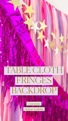 a table cloth with fringes and stars hanging from the ceiling in front of it