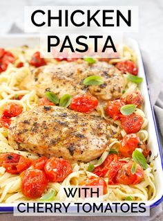 chicken pasta with cherry tomatoes in a white dish