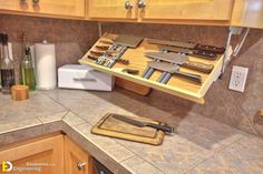 a kitchen counter with knifes and knives on it