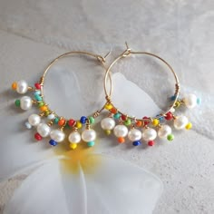 Rainbow earrings, colorful earrings, beach jewelry, big hoop earrings, modern jewelry, mothers day gift, freshwater pearl hoop earrings, wire wrapped earrings, cute earrings, summer jewelry, unique earrings, rainbow jewelry, 24K gold filled hoop. Modern trendy beach jewelry. These rainbow earrings look like a piece you might pick up on vacation. Wear them with everything from a T-shirt and jeans to your favorite swimsuit. HIGH QUALITY MATERIALS / SIZE 24-karat gold filled 20mm hoops wire wrapped Colorful Dangle Hoop Earrings For Summer, Colorful Handmade Hoop Earrings For Beach, Colorful Hoop Earrings For The Beach, Summer Gift Wire Wrapped Hoop Earrings, Rainbow Drop Earrings For The Beach, Rainbow Drop Earrings For Beach, Fun Rainbow Earrings For Beach, Colorful Bohemian Hoop Earrings For The Beach, Rainbow Earrings For Beach And Summer