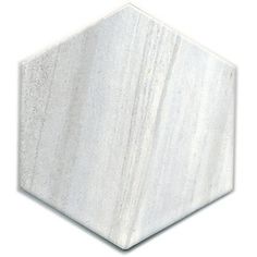 a white marble hexagonal tile on a white background, with the top half missing