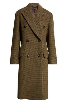 The Stockholm-based fashion house displays their tailoring prowess with this peaked-lapel coat cut in a timeless double-breasted silhouette from houndstooth-patterned tweed. 46 1/2" length (size 38 EU) Double-breasted button closure Peaked lapels Chest welt pocket; front flap pockets Lined 70% wool, 15% polyester, 10% nylon, 5% other fibers Dry clean Made in Portugal Designer Clothing Lapel Coat, Tweed Coat, Fashion House, Khaki Green, Welt Pocket, Double Breasted, Designer Clothing, Acne Studios, Dry Clean