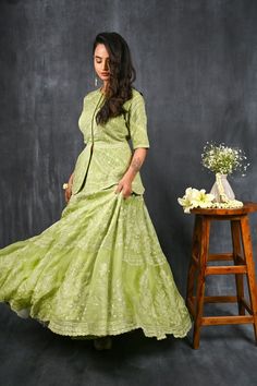 Twirl in style and elegance this festive season with this alluring pista green pure silk organza peplum lehenga from Pure Elegance featuring intricate tonal thread embroidery and slight shimmer work. Made with premium quality pure silk organza fabric, this set contains a choli, a lehenga. Pair it up with statement jewellery to complete your lookbook this season. Style this set with a pair of diamond earrings and solid pumps to finish the look from Pure Elegance. Disclaimer: The actual product ma Peplum Lehenga, Silk Organza Fabric, Pista Green, Embroidery Online, Fashion Journals, Statement Jewellery, Traditional Fabric, Organza Fabric, Thread Embroidery