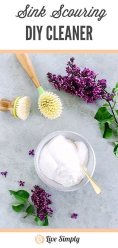 homemade diy cleaner recipe with lavender flowers and wooden spoons on the counter top