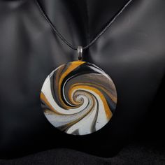 "From day-to-day, to special occasions, this intriguing piece will complement any style.  Hand crafted in polymer clay, and finished with crystal clear domed resin, this pendant is light and easy to wear.  Because of the production process, this piece is unique, and would make a great gift for a loved one, or for yourself (you deserve nice things too, you know!) This piece comes mounted on black cotton 1.5mm cord, adjustable from approx 80cm (32ins) to 40cm 16ins).  However, you can request any length of cord - just leave a message in the \"note to seller\" section at checkout.  If you would prefer the pendant mounted on a cord with adjustable lobster clasp, please add the item \"waxed cotton cord necklace\" to your basket, and please remember to state what length cord you would like in th Artistic Resin Jewelry, Unique White Round Pendant Necklace, Modern Resin Jewelry For Gifts, Modern Resin Jewelry Gift, Unique Circular Necklace For Gifts, Unique Circle Necklace For Gifts, Circular Polymer Clay Jewelry Gift, Elegant Hand Painted Round Necklaces, Unique Hand Painted Round Necklaces