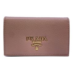 This womens Prada card case wallet features beautiful neutral grained leather that makes it the perfect accessory for anybody. The Prada Paris logo featured on the front is eye-catching. Its large interior and two slip pockets mean organizing is a breeze. You'll never want to leave home without this sophisticated wallet. Includes authenticity cards and Prada box. Size: one size.  Color: Beige.  Gender: female.  Age Group: adult. Leather Card Holder Wallet, Leather Credit Card Holder, Paris Logo, Card Case Wallet, Leather Card Case, Card Holder Wallet, Small Wallet, Credit Card Holder, Card Holder Leather