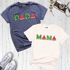 "Celebrate parenthood in style with our \"Watermelon Mama Dada\" shirt! This unique and fun tee is the perfect gift for Mother's Day or any special occasion, and it's designed for both moms and dads to wear with pride. Made from premium quality fabric, our shirt is soft, comfortable, and built to last. The playful watermelon design with the words \"Mama\" and \"Dada\" adds a touch of sweetness and humor, making it a perfect choice for family matching outfits or just a standalone statement piece. Celebrate the joy of parenthood with our \"Watermelon Mama Dada\" shirt. Order now and make a fun and stylish statement that will bring smiles to your faces and create lasting memories for your family! You can find other sizes of this shirt in the links below. By clicking on the link, you can go to Cotton Tops With Fruit Print For Vacation, Family Matching Funny Print Tops For Summer, Family Matching Tops With Funny Print For Summer, Fun Green Printed Tops, Family Matching Funny Print Summer Tops, Summer Family Matching Crew Neck Shirt, Fun Watermelon Colored Tops For Summer, Fun Watermelon Color Tops For Summer, Fun Watermelon Color Summer Tops