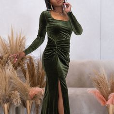 The Velvet Maxi Dress is long line dress in emerald green and is designed with the illusion of a rouched wrap feature. The dress includes a flattering rounded square neckline, fitted long sleeves and thigh high front slit.  The dress is a stretchy, hugs in all the right places and fastens in a centre back invisible zip.  The dress is often worn at special occasions, and especially makes a perfect wedding guest look. Cold Wash - Wash on a cool temperature, 30 degrees  Do Not Tumble Dry  Medium He Velvet Maxi Dress, Velvet Maxi, Rounded Square, Wedding Guest Looks, Invisible Zip, Line Dress, Matches Fashion, Independent Designers Fashion, Thigh High