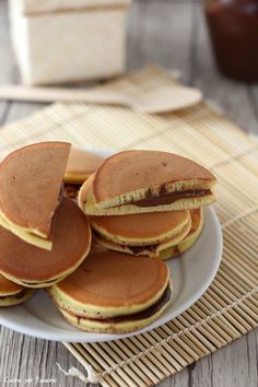 some pancakes on a plate with chocolate sauce