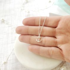 "Beautiful handmade anchor necklace in 925 sterling silver. This delicate necklace is perfect as a gift for a special woman, Christmas gift, beach wedding, bridesmaid, birthday or her special day. ♥ Details: Metal type: Sterling silver Karat / purity: 925 Anchor dimensions: 9.7 x 8.1mm Chain length: 14\", 16\", 18\", 20\". The necklace is 100% handmade. Each necklace takes approximately 2 hours to be ready, so you are buying a piece that was made with love and dedication. All jewelry comes with Minimalist Sterling Silver Jewelry For Beach, Adjustable Nautical Style Jewelry For Gifts, Nautical Style Adjustable Jewelry Gift, White Nautical Jewelry For Gift, Everyday Nautical Anchor Jewelry, Everyday Silver Anchor Jewelry, Nickel-free Sterling Silver Anchor Jewelry, Nickel-free Anchor Shaped Sterling Silver Jewelry, Everyday Silver Jewelry With Anchor Shape