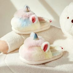 These cozy Winter Kids Plush Unicorn Slippers are sure to bring a smile to your child's face. Made with soft and plush material, these slippers are designed to keep little feet warm and comfortable. The adorable unicorn design adds a touch of fun to any day. Perfect for lounging at home or for a sleepover with friends. Cute Winter Slippers For Playtime, Playful Winter Slippers With Soft Sole, Fun Multicolor Round Toe Slippers, Playful Winter Slippers For Playtime, Playful Winter Slippers, Plush Slippers With Round Toe And Plush Lining, Cute Plush Indoor Slippers, Playful Multicolor Round Toe Slippers, Cute Multicolor Slippers With Round Toe