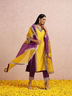 Featuring a plum and golden yellow colourblockchanderi kurta set with gota and hand embroidery. It is paired with pants and a colourblock silk organza dupatta. Color: Golden Yellow and Plum Fabric: Chanderi Note: The product will be shipped within 30-35 days of order placed Wash care - Dry Clean Only. Do not use heavy Iron Festive Purple Salwar Kameez With Embroidered Border, Yellow Silk Unstitched Suit Straight Kurta, Yellow Cotton Silk Unstitched Suit For Diwali, Yellow Silk Churidar For Eid, Yellow Traditional Wear With Embroidered Border In Dola Silk, Yellow Chanderi Unstitched Suit With Straight Kurta, Chanderi Salwar Kameez With Embroidered Border For Celebration, Celebration Chanderi Salwar Kameez With Embroidered Border, Festive Yellow Unstitched Suit With Sheer Dupatta