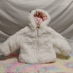 Rare! Child's Winter Fox Full Zip Up Winter Coat With Hood!! Has Adorable Rabbits Print Lined In Hood! I Have Not Found Another Like This Anywhere! Size 24! Amazing Condition For Age! Please See All Pictures! This Is Not New But A Rare Jacket And In Great Vintage Condition! No Stains Or Rips Anywhere! Measurements Laying Flat: Pit To Pit: 13". Length: 13 1/2". Sleeve Length: 11 1/2". Smoke And Pet Free Home! Reasonable Offers Always Welcome! If You See Something You Love Please Feel Free To Make Your Best Offer! We Never Decline Only Accept Or Counter All Offers! Have A Blessed Day Cute White Outerwear For Fall, Adorable Rabbits, Coat With Hood, Rabbit Print, Have A Blessed Day, Vintage Coat, Kids Jacket, Rabbits, Winter Coat