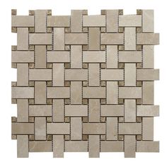 a white and beige tile pattern on a wall