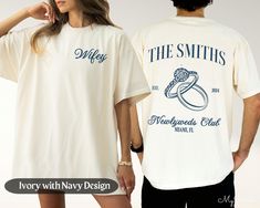 a man and woman standing next to each other wearing t - shirts that say the smiths