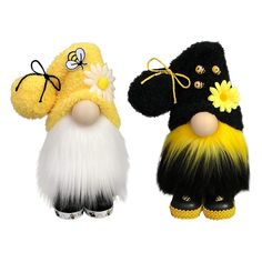 two gnomes are dressed in black, yellow and white