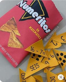 a bag of candy sitting on top of a table next to some cut out numbers