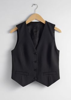 Single-breasted vest designed with duo welt pockets.• Regular fit• Fully lined• V-cut neckline • 46% RWS Wool certified by Control Union 893290Length of vest: 37cm / 14.6" (EU 36 / UK 8 / US 4) Fitted Business Vest With Pockets, Notch Lapel Vest With Button Closure For Work, Classic Notch Lapel Vest For Fall, Classic Workwear Vest With Button Closure, Fitted Vest For Workwear With Flat Front, Fitted Flat Front Vest For Work, Fitted Blazer With Vest For Work, Fitted Vest With Button Closure For Work, Business Vest With Welt Pockets