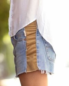 the bottom half of a woman's jean shorts