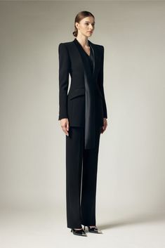 With its sleek satin crepe material and structured design, this blazer exudes sophistication and exclusivity. The extended flap adds a touch of elegance to this already refined piece. Elevate any outfit with this must-have blazer. Elegant Semi-formal Pantsuit With Pressed Crease, Tailored Satin Blazer For Semi-formal Occasions, Luxury Long Sleeve Formal Pantsuit, Elegant Office Pantsuit With Structured Boning, Elegant Long Sleeve Pantsuit, Chic Evening Blazer With Lapel Collar, Tailored Elegant Pantsuit For Formal Occasions, Elegant Blazer With Lapel Collar, Elegant Pantsuit With Pressed Crease