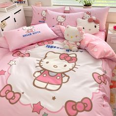 a hello kitty bed with pink sheets and pillows