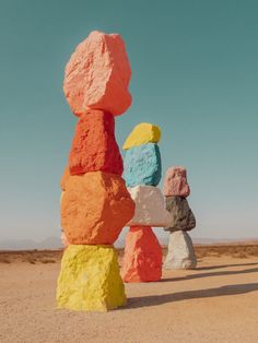 colorful rocks stacked on top of each other in the desert