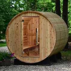 a wooden sauna in the middle of a park