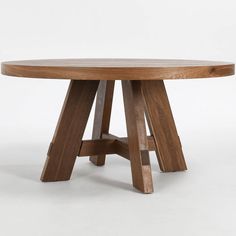 a round wooden table with four legs