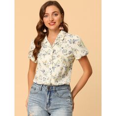 This lovely shirt features a notched lapel collar, a V neckline, short sleeves, and a button-up front, all adorned with a beautiful floral print. It's perfect for any casual occasion, be it a day out with friends or a relaxing weekend getaway. You can pair it with shorts for a laid-back look that's both comfortable and stylish. To keep it in top condition, just machine wash it in cold water with like colors. The model is wearing an X-Small. Enjoy your new favorite shirt! Short Sleeve Floral Print Shirt For Work, Floral Print Short Sleeve Work Shirt, Workwear Floral Print Short Sleeve Shirt, Daywear Blouse With Camp Collar, Spring Tops With Johnny Collar, Collared Short Sleeve Floral Print Shirt For Spring, Summer Blouse With Collar And Button Closure, Spring Short Sleeve Shirt With Button Closure, Spring Top With Johnny Collar And Button Closure