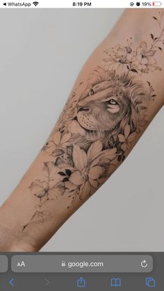 a lion with flowers on his arm