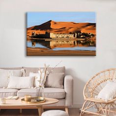 a living room scene with focus on the water and sand dunes in the back ground