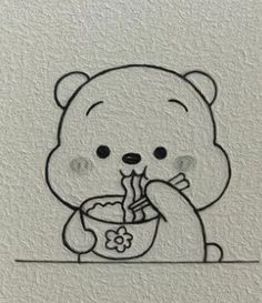 a drawing of a bear holding a bowl with food in it's mouth and eating