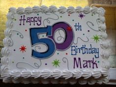 a white birthday cake with the number fifty five on it's side and stars