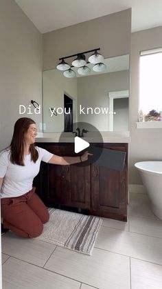 a woman kneeling on the floor in front of a bathroom sink and mirror with words that read, did you know?