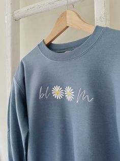 Description This Bloom Crewneck is the perfect way to rep 'Ivory Bloom' in style! Softer and plusher than a bed of daisies, this blue bloom-printed crewneck is as comfy as it is cool. Time to bloom where you are planted! Details - 100% Cotton - Embroidered crewneck Clothing Business, Embroidery Tshirt, Bloom Where You Are Planted, Embroidered Crewneck, Embroidered Clothes, Embroidery And Stitching, Christian Clothing, Blue Tshirt, Business Ideas