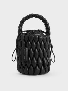 This product is made with at least 20% sustainable materials by weight. CHARLES & KEITH uses recycled, degradable, organic, and water-based materials in our eco-conscious collection.Stand out from the crowd this season with this Bia bucket bag in timeless black. Featuring an eye-catching woven finish that adds both visual and textural interest to the design, this understated carrier will be the star of all your outfits, from polished date-night ensembles to casual off-duty looks. Perfectly sized Black Saddle Bag, Lux Fashion, Chic Crossbody Bag, Buy Bags, Classic Handbags, Bags Shop, Charles Keith, Handbags Online, Travel Light