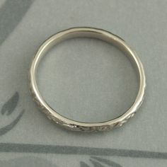 White Gold Skinny Flourish Band Women's Wedding Band Women's White Gold Band Vintage Style Band Antique Style Ring White Gold Wedding Band This is a slimmer version of our Flourish Le Femme band: https://www.etsy.com/listing/151251996 And our Flourish Wide: https://www.etsy.com/listing/179128813 At a dainty 2.4mm wide by 1.5mm thick, this is the perfect thinner wedding band or stacking ring. You simply can't do without it! Pair it with your other stacking rings or wear it alone as a symbol of yo Classic Adjustable Wedding Bands, Heirloom Wedding Band Adjustable, White Gold Wedding Ring With Decorative Band, Heirloom Wedding Ring With Decorative Band, Wedding Bands With Intricate Design, Heirloom Silver Wedding Bands, Wedding Bands With Diamond Cut In Silver, Silver Wedding Bands With Diamond Cut, Silver Diamond Cut Wedding Bands