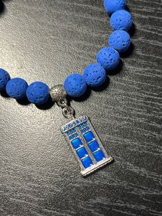 "> DESCRIPTION <  Doctor Who has a strong connection to the earth and always offers his protection from all manner of threats. Lava stone strengthens your connection to the earth. The bright blue lava stone in this bracelet matched perfectly with thee blue enamel on the metal TARDIS charm.  Show off your fandom and start great conversations with Whovians and potential fans with this bracelet.  The bracelet is about 7.25\" long, but can be resized upon request. Message me with any changes.  The T Blue Lava, Tardis Blue, Celtic Heart, Calming Stones, Lava Stone, Unique Pendant, Bright Blue, The Earth, Doctor Who