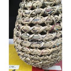 a large woven basket sitting on top of a table