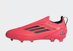 the adidas soccer shoe is pink and black