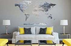 a living room filled with furniture and a large map on the wall above it's couches