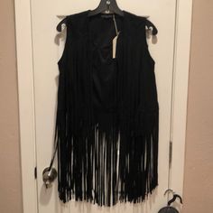 Black Micro Fiber Suede Feel Fringe Vest. Super Cute Waist Length Vest With Long Fringe. The Vest Is Open Front No Closure And Runs About A Size Smaller Than Normal. Chic Black Outerwear With Fringe, Black Vest For Night Out In Fall, Fitted Black Outerwear With Fringe, Fitted Black Fringe Outerwear, Black Fringe Outerwear For Party, Black Fall Party Vest, Black Fringe Party Outerwear, Black Party Vest For Fall, Fringe Vest