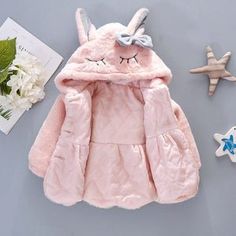 Introducing our enchanting Bunny Ears and Bow Plush Hooded Jacket, designed to add a touch of whimsy and warmth to your little one's wardrobe, tailored for toddlers aged 6 months to 3 years. This jacket is not just a winter essential; it's a delightful fashion statement that will make your child the center of attention wherever they go. Fuzzy Coat, Bling Design, Plush Coat, Toddler Age, Baby Jacket, Winter Girls, Rabbit Ears, Kids Outerwear