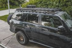 a black jeep parked on the side of a road